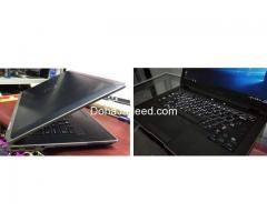 Dell i7 latitude big body laptop with keyboard background light.