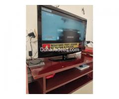 LG TV with Wooden TV Stand